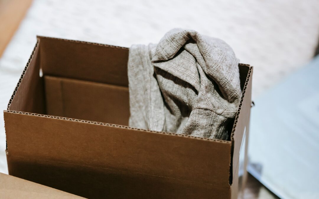 Open box with folded clothing inside